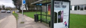 Bus stop in crawley with flag and electronic display